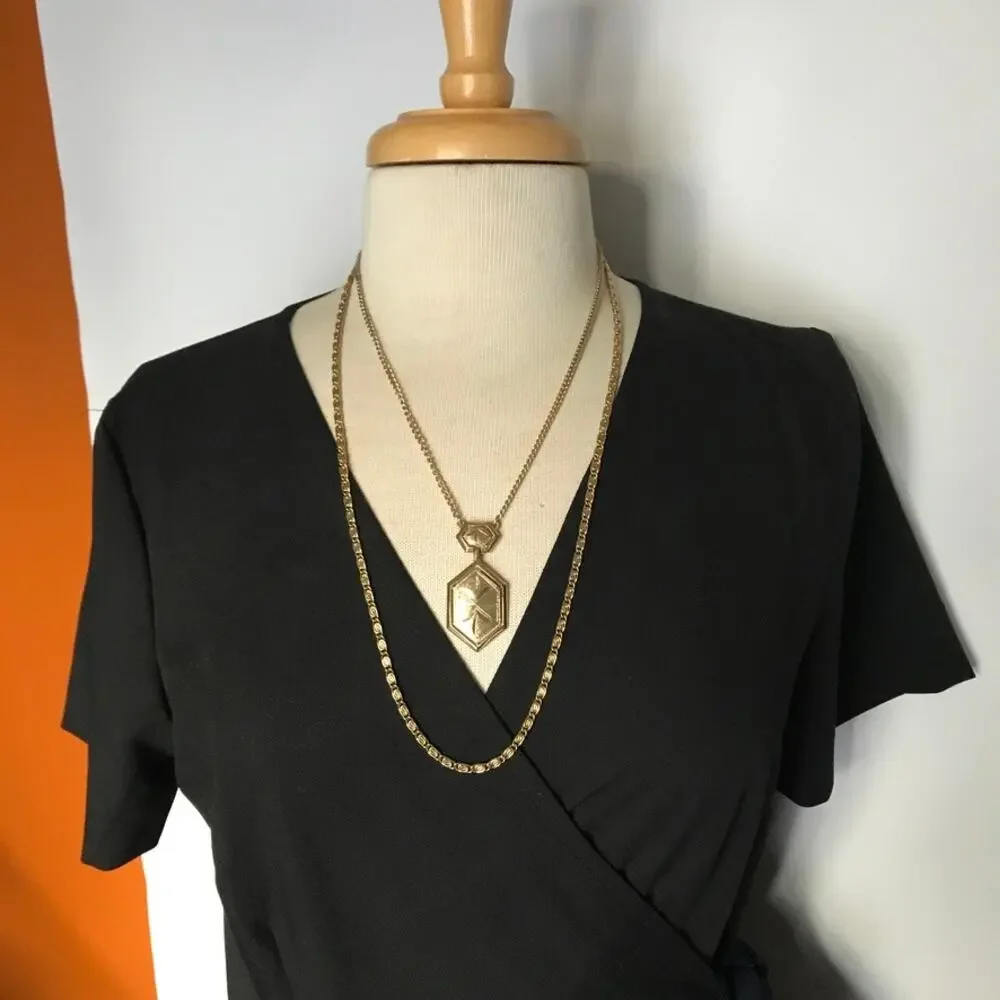 Vintage gold tone two-strand necklace, starburst design pendant